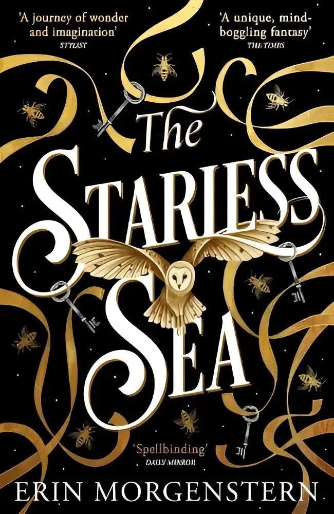 The starless sea boek met zwarte cover en gouden ornamenten met uil in witte letters de spellbinding sunday times bestseller