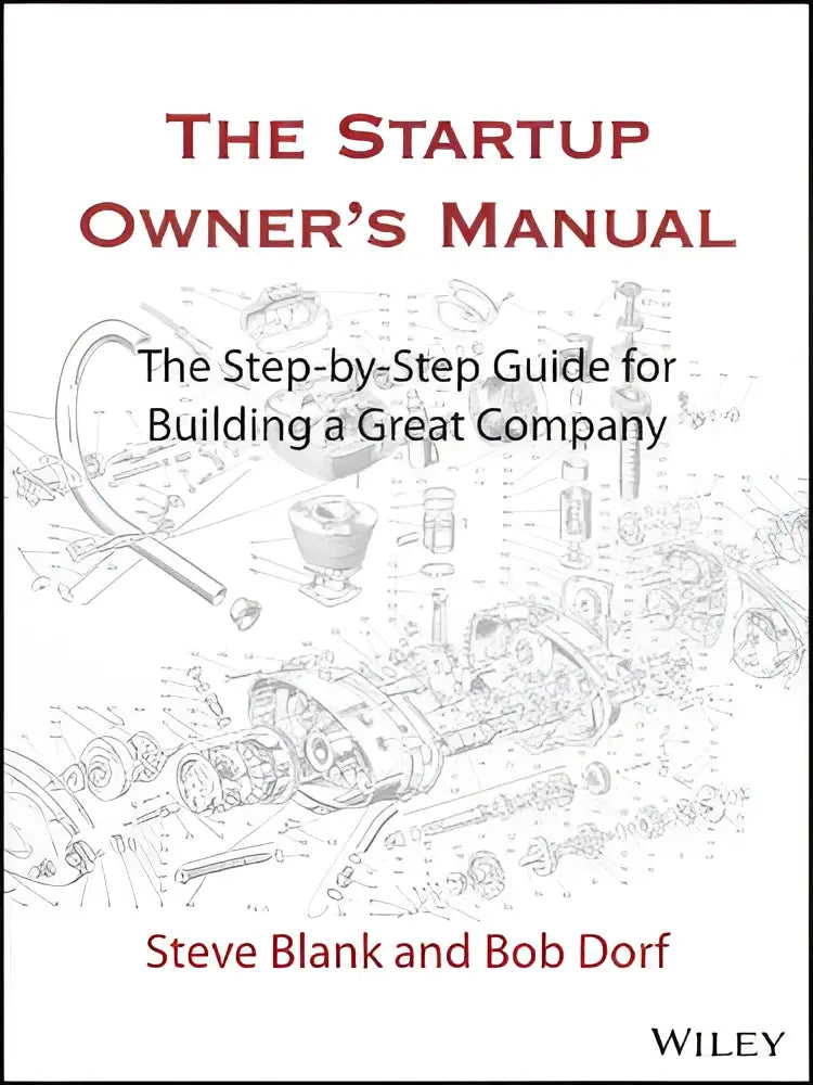 The startup owner’s manual book with a white cover featuring red and black text and mechanical parts line drawing