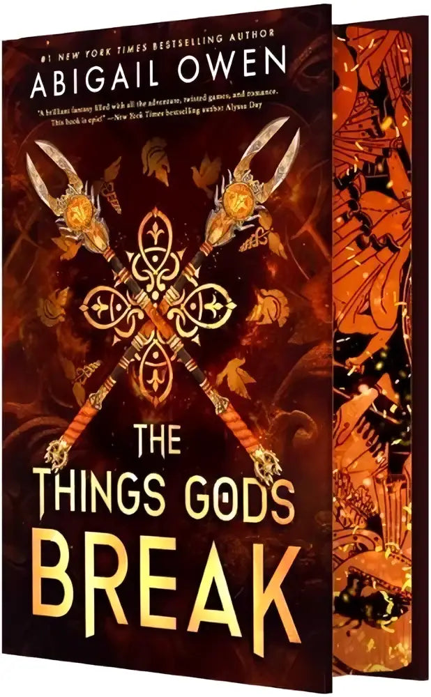 The things gods break by abigail owen hardcover book with ornate golden spears cover in fiery orange for greek gods romantasy