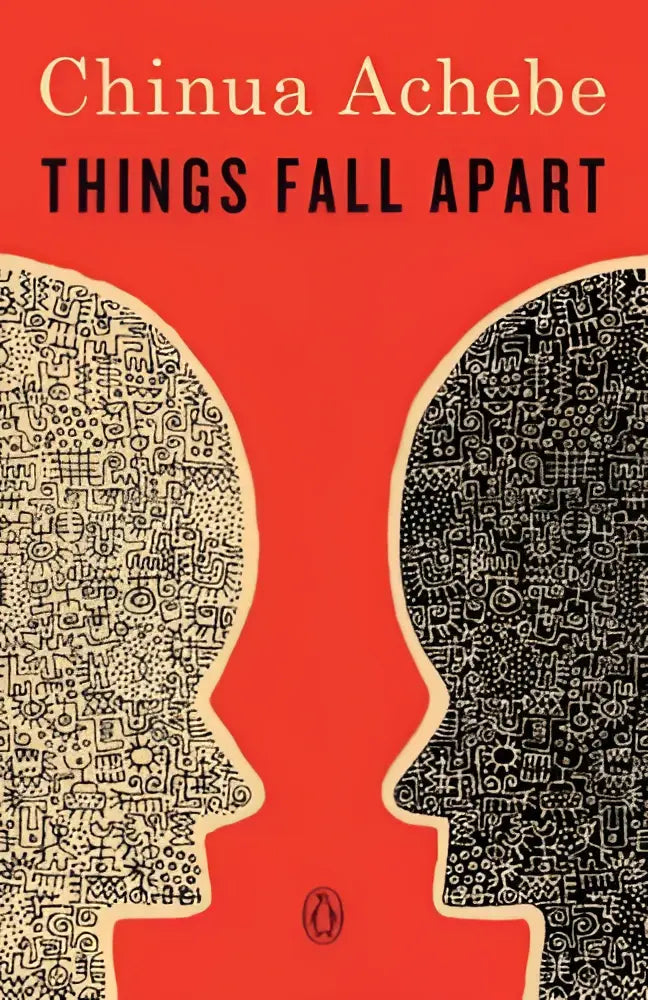 Rode hardcover roman met zwart-wit geïllustreerde gezichten op de cover van things fall apart
