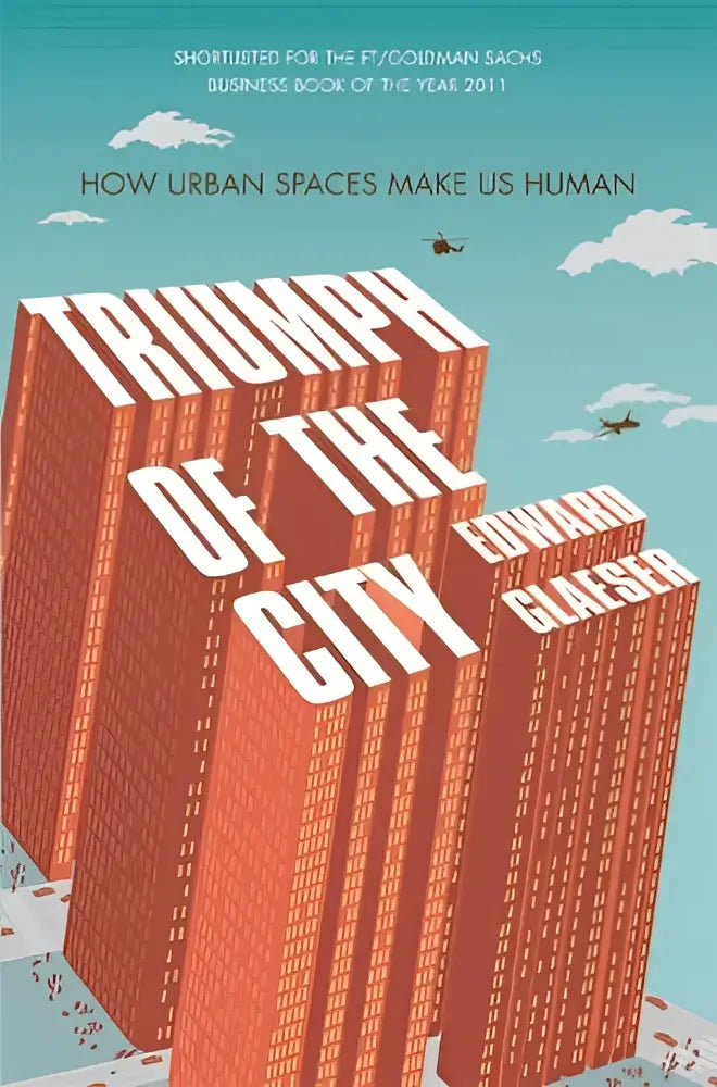 De boekcover van triumph of the city door edward glaeser toont witte tekst op oranje-rode wolkenkrabbers en blauwe lucht