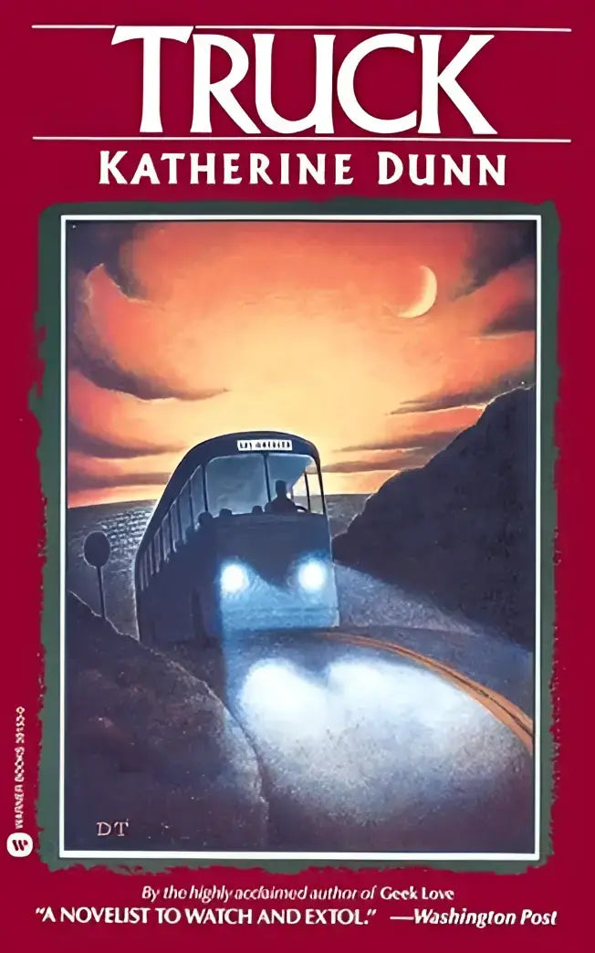 Boekcover truck met rode achtergrond, witte titel, auteur katherine dunn en illustratie van bus in berglandschap bij schemering