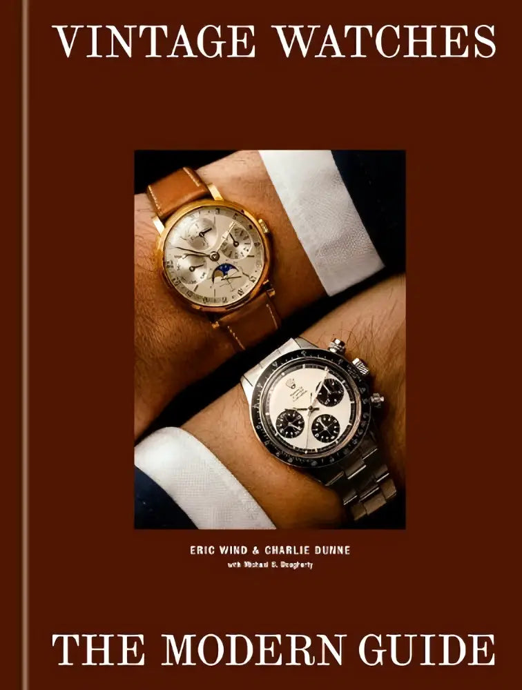Vintage watches met een vintage rolex daytona zilverkleurige stalen kast en band, zwart bezel en witte wijzerplaat met subdials