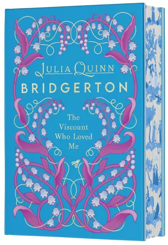 Een levendig blauw hardcover boek met roze en witte lelietje-van-dalen illustraties en goudfolie tekst viscount who loved