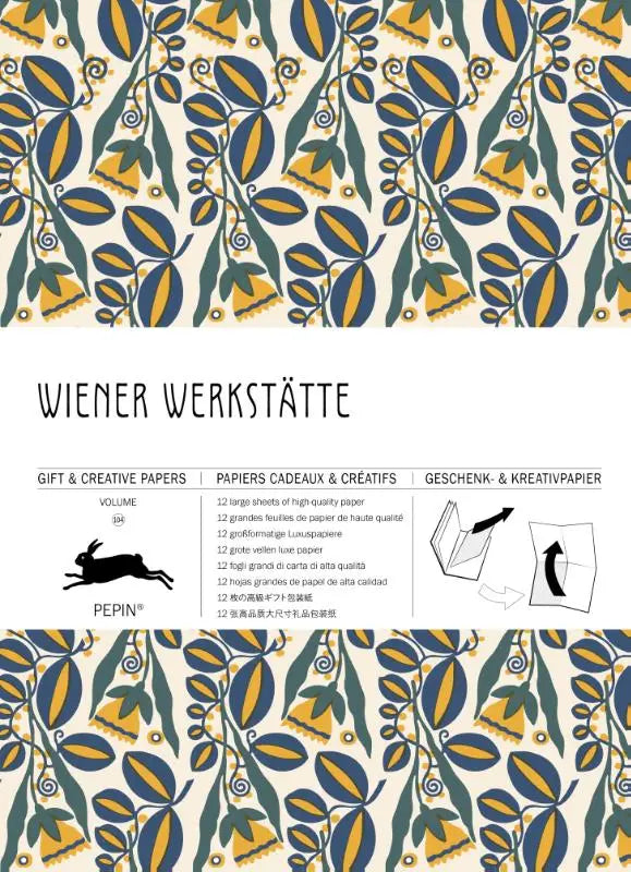 De wiener werkstaette creative paper book vol 104 heeft cadeaupapier met blauwgele en groene bladeren op crèmekleurig papier