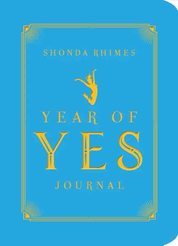 Helderblauw hardcover yes journal met goudfolie letters en gouden dansersilhouet boven de titel year of yes journal