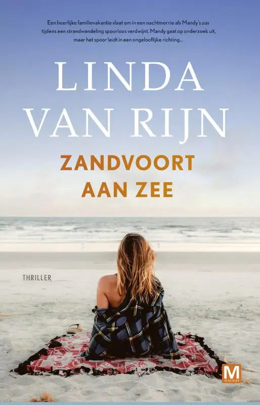 A woman with long wavy hair sits on a beach wrapped in a dark blue and black plaid blanket red trim zandvoort aan zee literaire thriller uitgeverij marmer