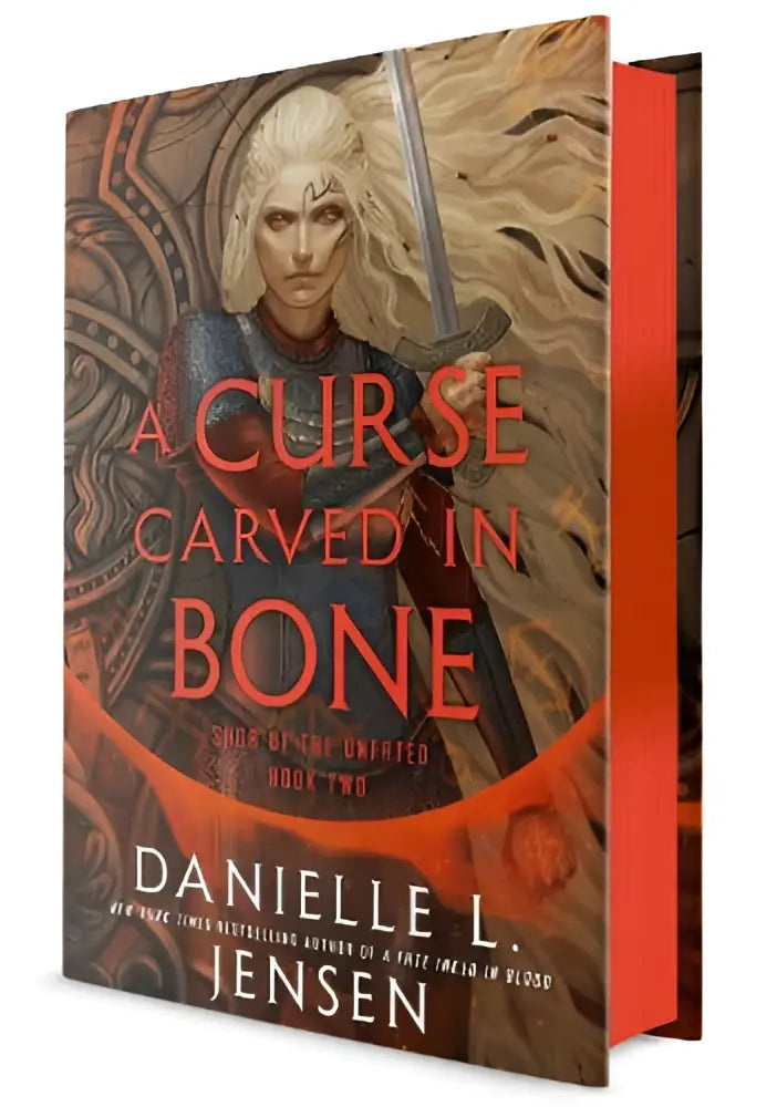 A hardcover book titled a curse carved in bone by danielle l featuring a pale-haired warrior from the saga the unfated
