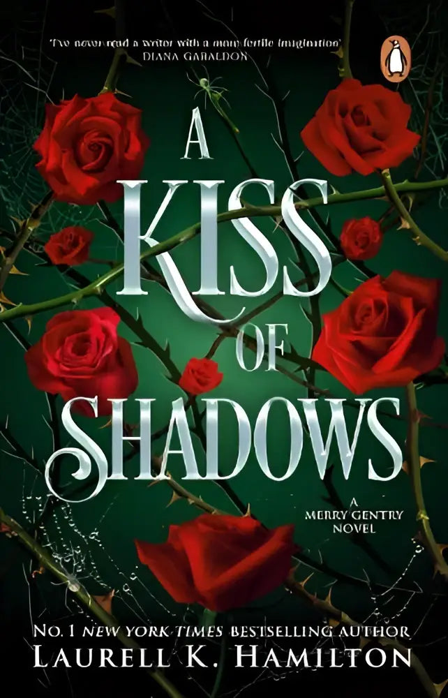 A kiss of shadows hardcover by transworld publishers ltd featuring dark green cover with red roses and silver title for merry gentry