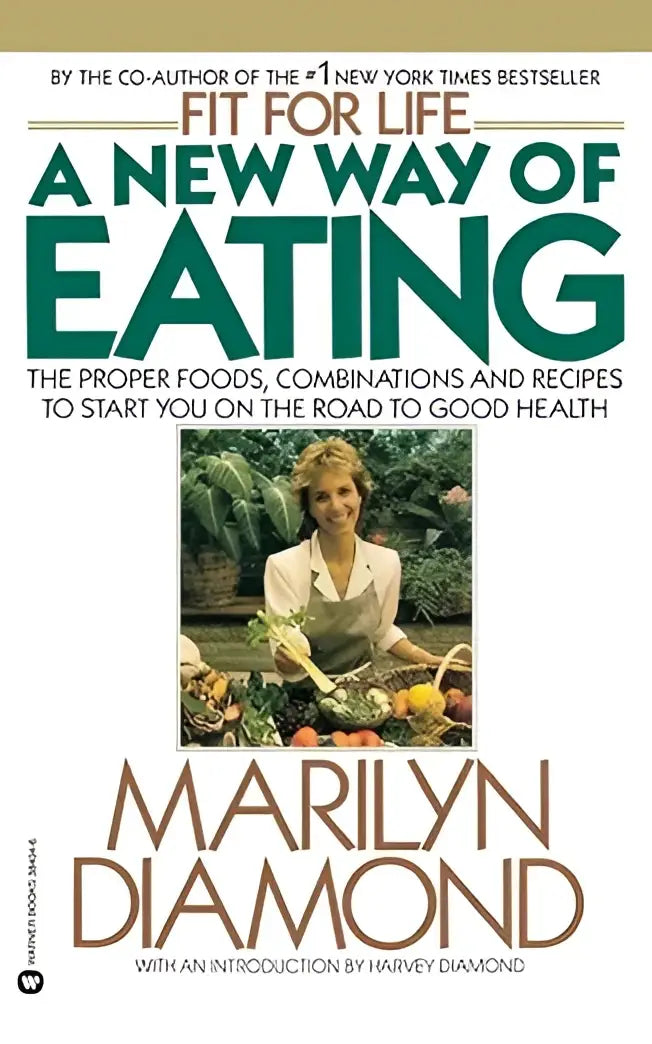 A hardcover book with a white cover and green and brown text titled fit for life a new way of eating by marilyn diamond