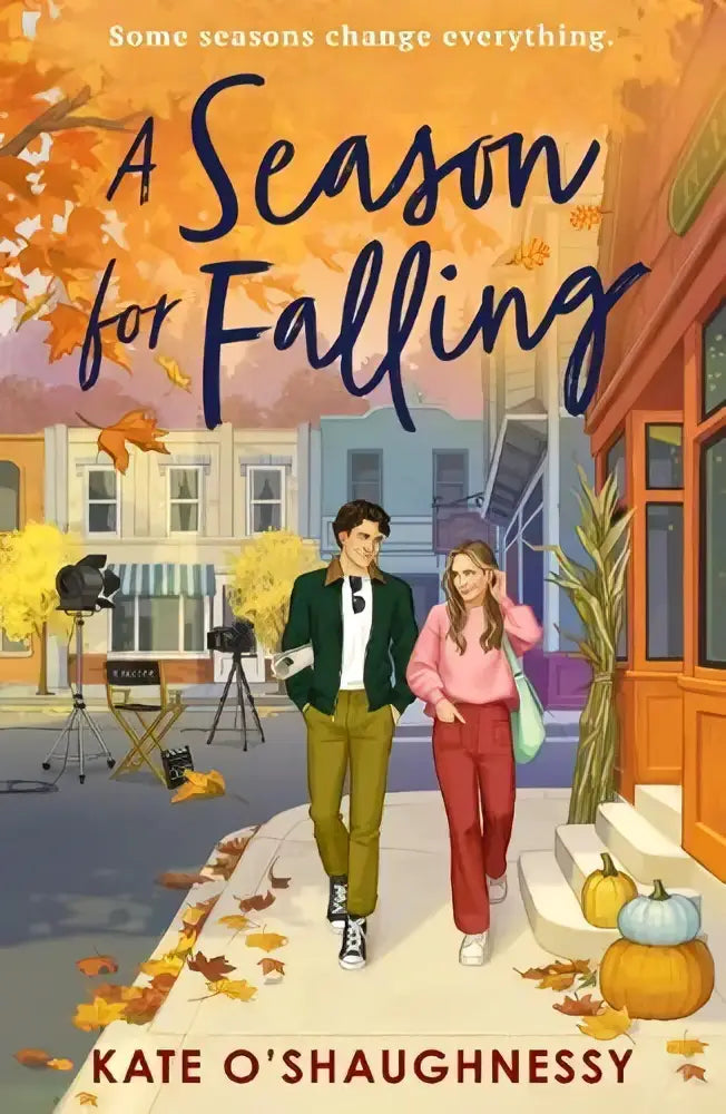 A season for falling softcover book with autumn-themed cover showing two characters walking by pumpkins and falling leaves