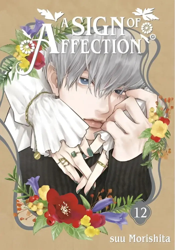 Cover van manga boek a sign of affection 12 met zilverharig personage in zwart met witte ruches omgeven door bloemen