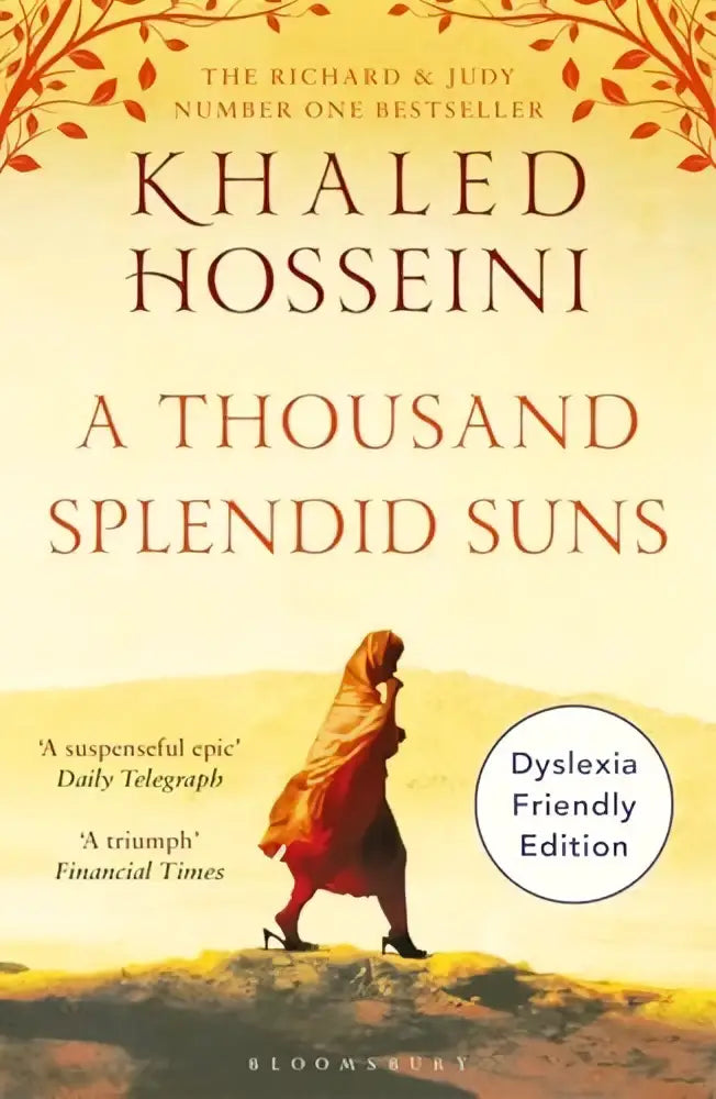 Harde kaft editie van thousand splendid suns met oranje en beige omslag en vrouw in traditionele kleding op woestijnlandschap