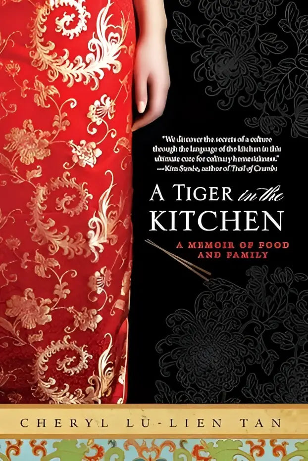 Rode zijden boek met goudkleurige bloem borduursels en zwarte patroon rug getiteld a tiger in the kitchen van cheryl l