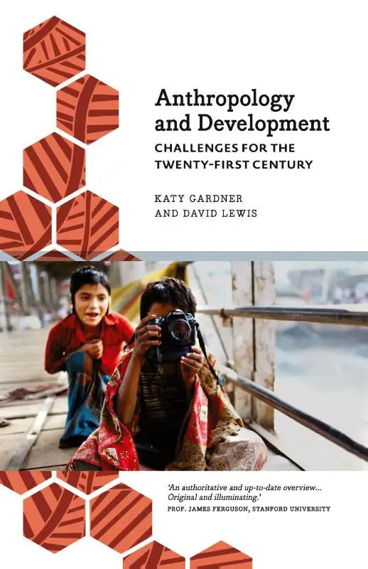 The book cover for anthropology and development challenges for the twenty first century showing two children one holding a camera on an orange hexagonal background