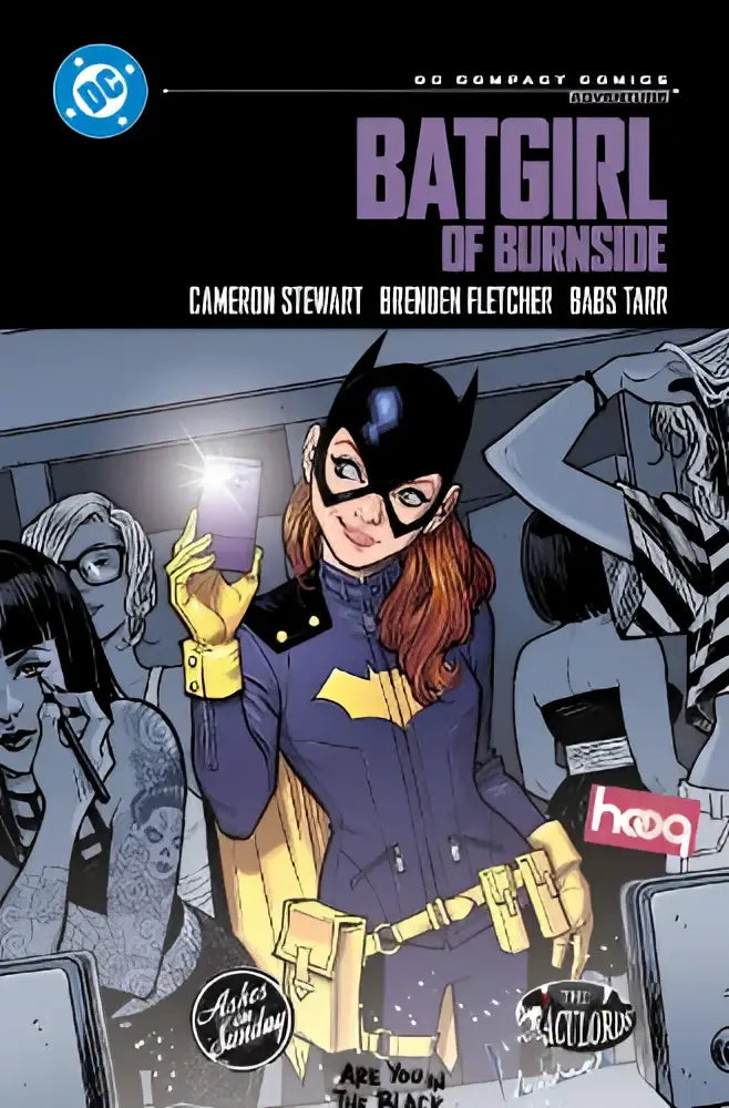 Cover of batgirl of burnside compact comics edition featuring batgirl in purple and yellow suit holding glowing phone