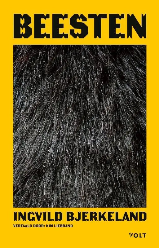 Boek beesten met zwart bont omslag en vetgedrukte zwarte tekst op felgele achtergrond