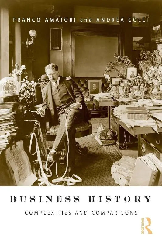Sepia toned book cover of business history complexities and comparisons showing a man at a cluttered desk