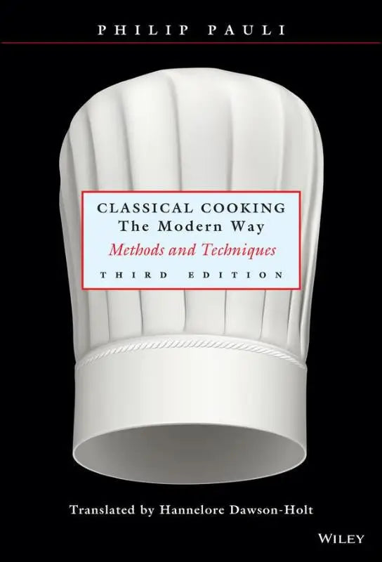 Boekomslag witte koksbaret met de titel classical cooking the modern way door philip pauli voor klassieke kooktechnieken