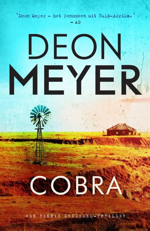 De boekcover van cobra toont een rustieke windmolen met groene en witte wieken in een gouden veld onder een blauwe lucht