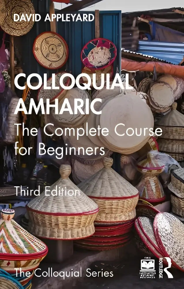 De boekcover toont de titel colloquial amharic complete course for beginners in witte tekst met geweven manden als achtergrond