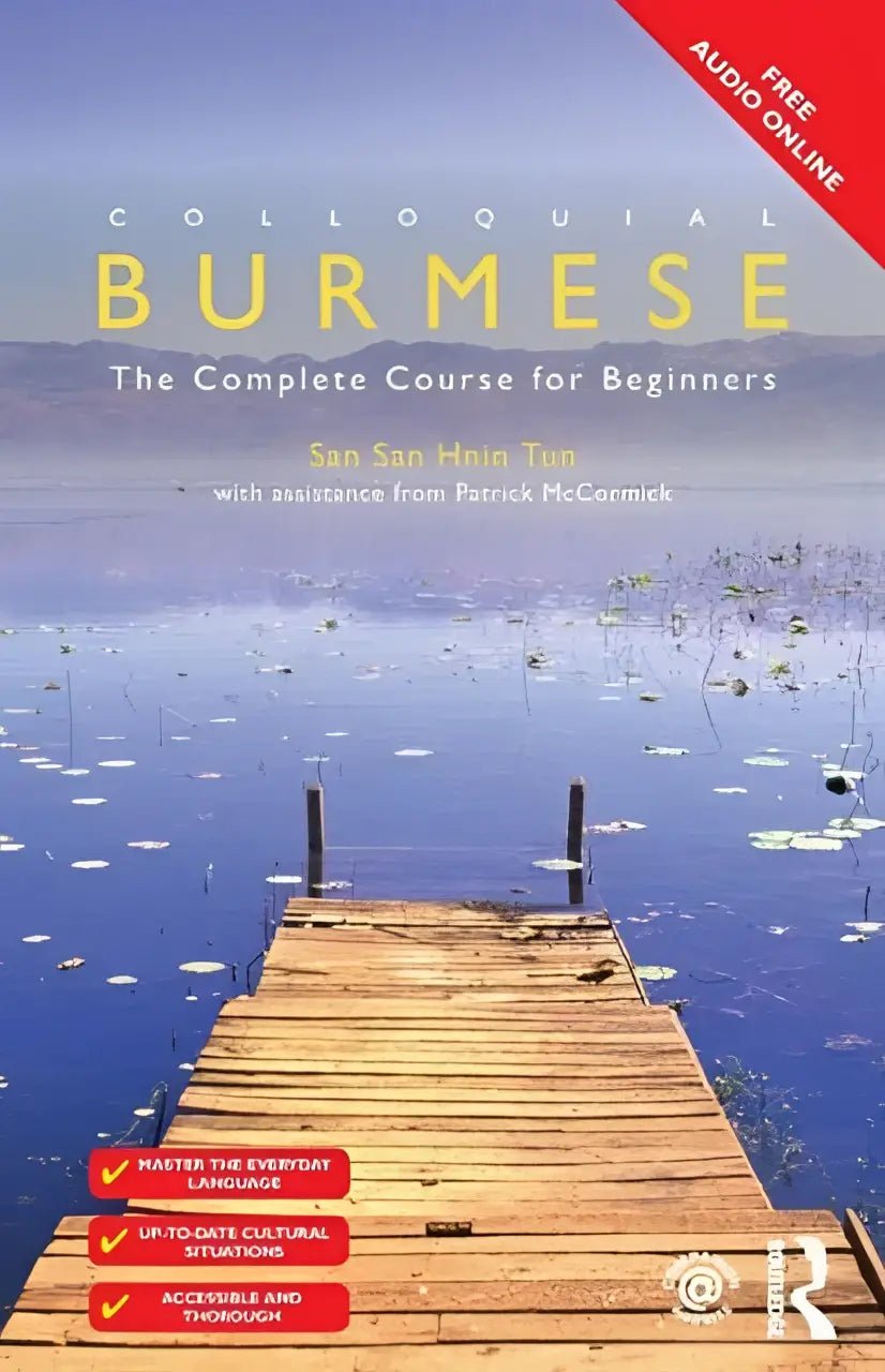 De cover van colloquial burmese boek toont een houten steiger die uitstrekt over rustig blauw water met waterlelies