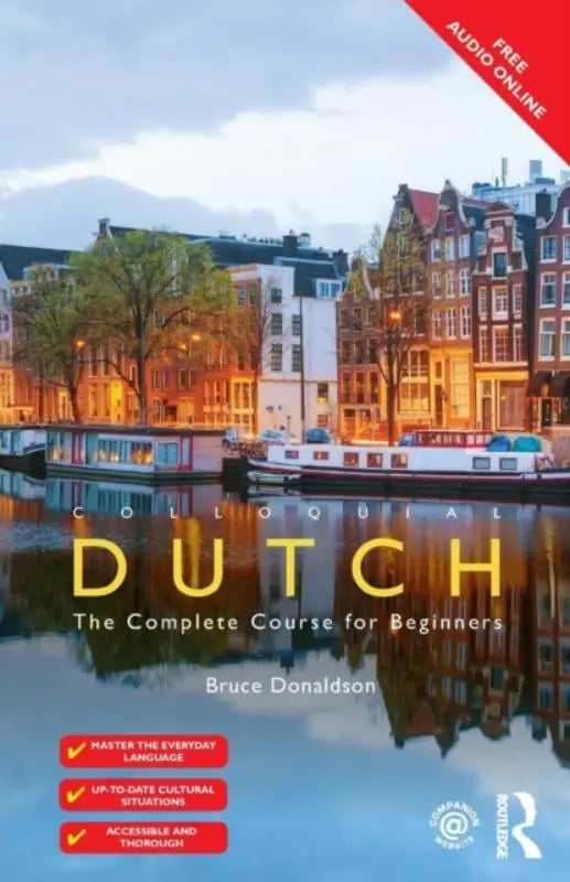 The cover of colloquial dutch a complete language course shows a scenic canal view with illuminated buildings reflecting in water