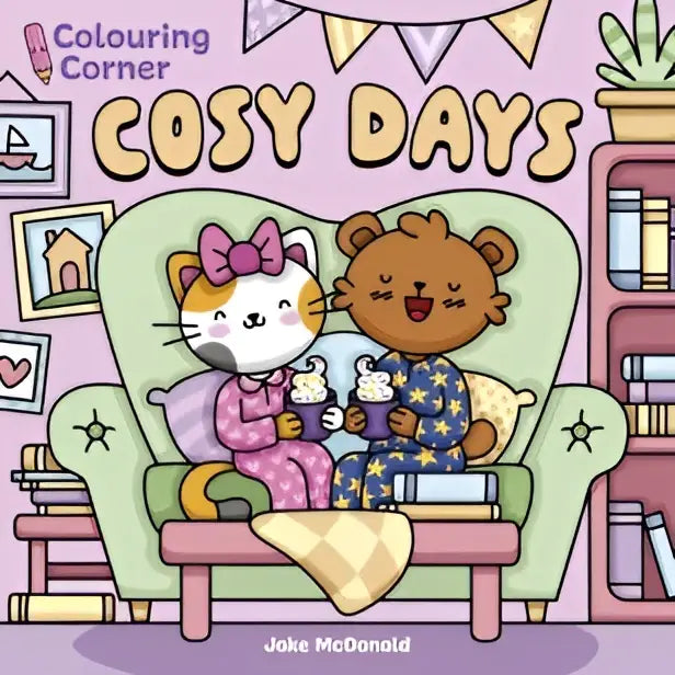 A cosy days pastel green armchair with star-patterned cushions and a soft pink throw in colouring corner