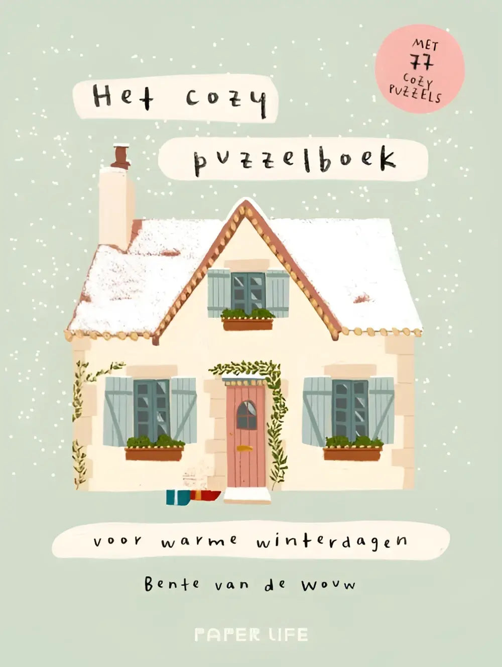 Het cozy puzzelboek voor warme winterdagen met knusse illustraties van een sneeuwbedekt huisje met beige muren en blauwe luiken
