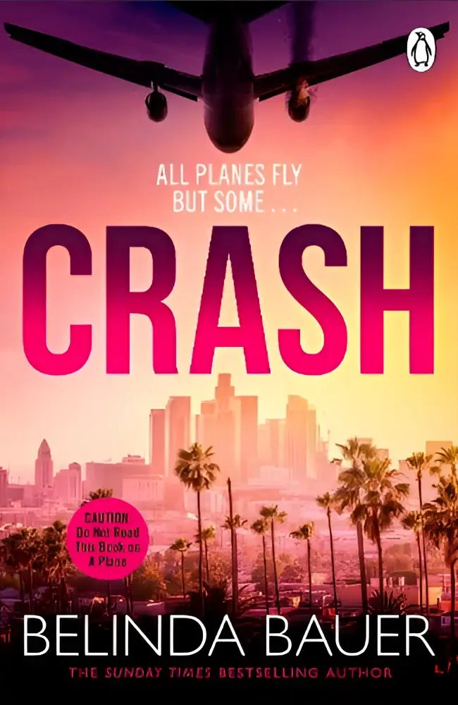 The book cover of crash by transworld publishers ltd shows a silhouette of an airplane over a city skyline at sunset in pink letters