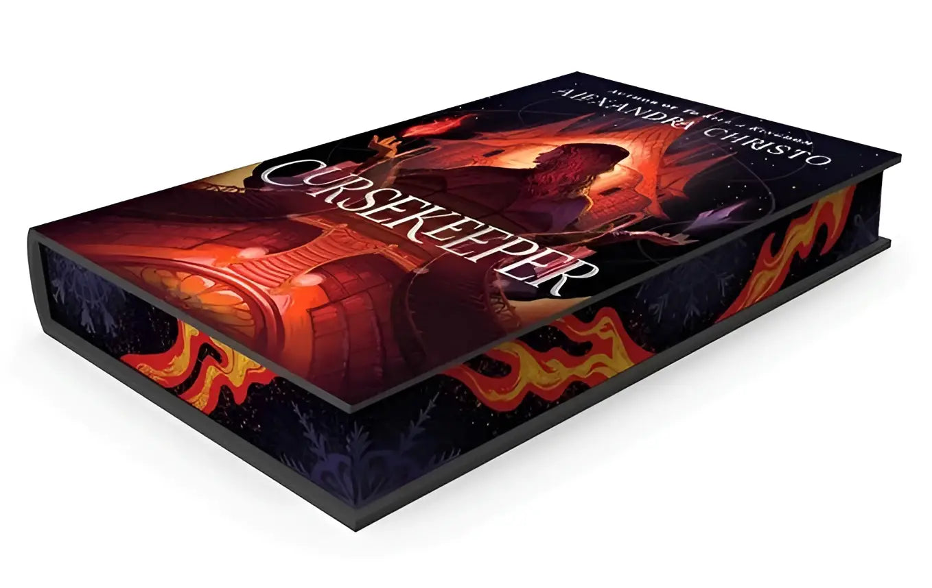The hardcover cursekeeper deluxe edition by alexandra christo features a fiery cover with orange and red flames on a dark background