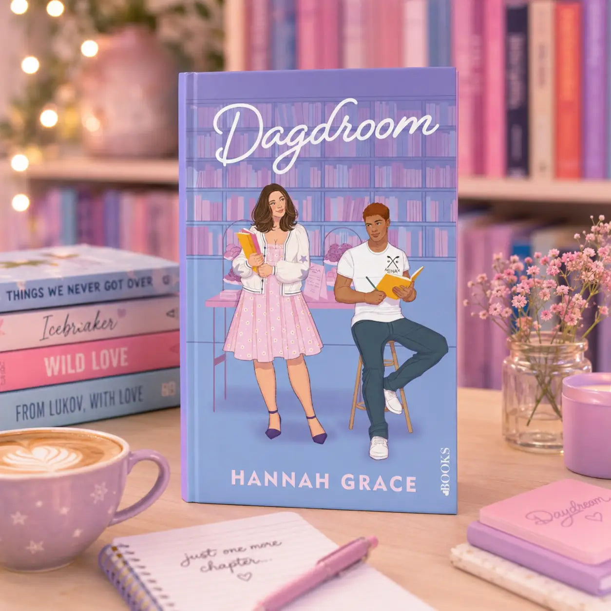 Paars hard cover boek dagdroom van hannah grace met illustratie van vrouw in roze jurk en man bij bureau van maple hills-serie