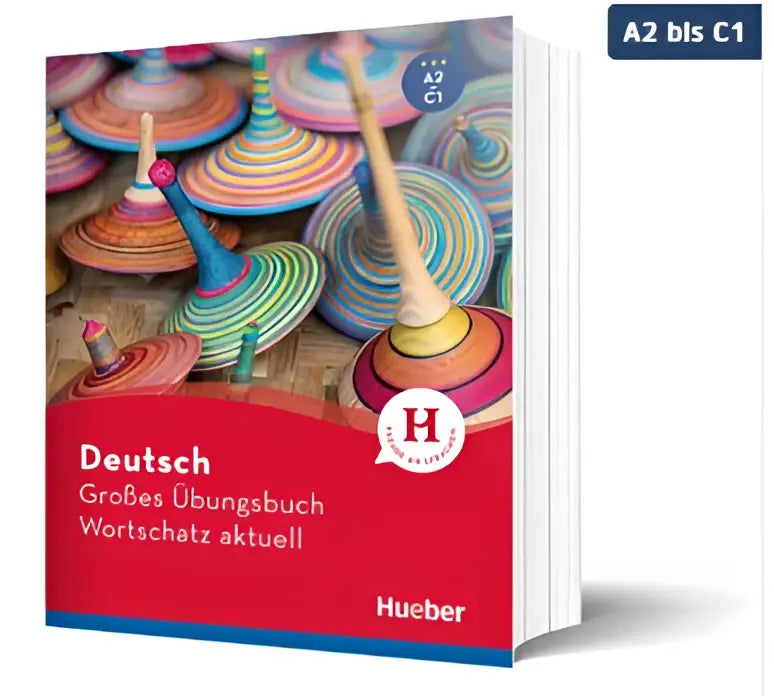 Het wortschatz aktuell a2–c1 duitse woordenschat oefenboek van hueber heeft een rode en blauwe omslag met kleurrijke tolletjes