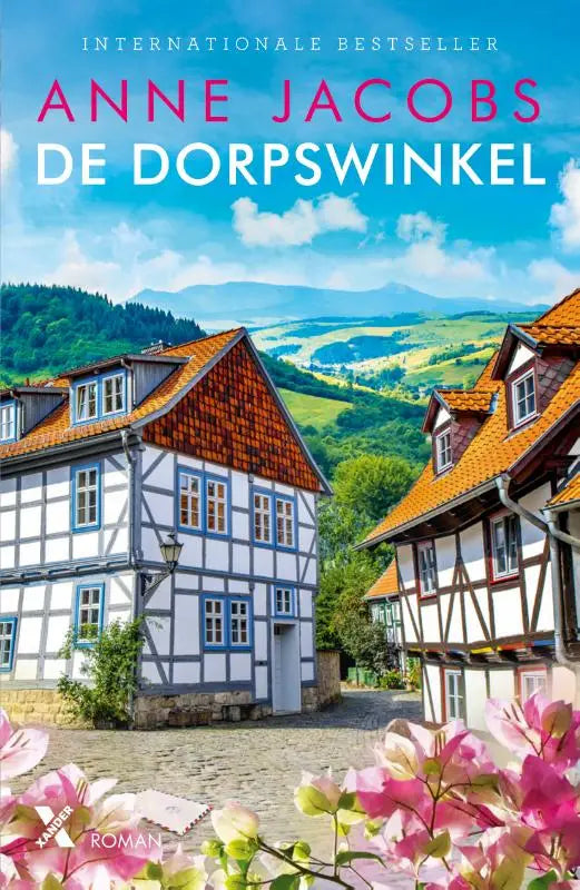 Boek cover de dorpswinkel met traditionele vakwerkhuizen wit en hout oranje dakpannen tegen groene heuvels en blauwe lucht