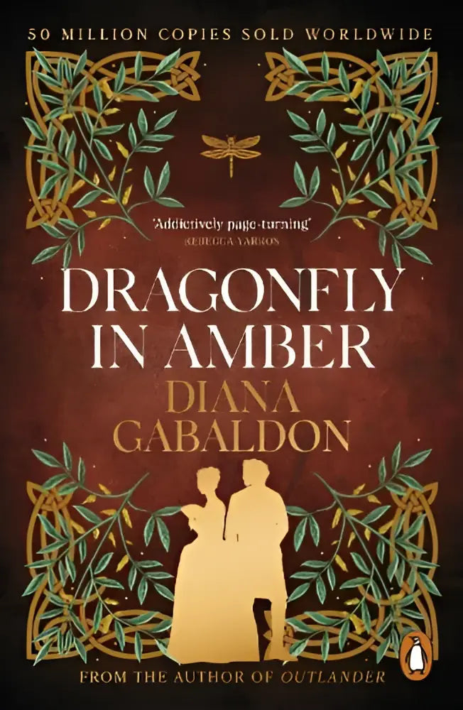 De boekomslag van Dragonfly in Amber van Diana Gabaldon toont een diep rode achtergrond met gouden en groene bladeren