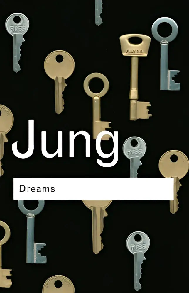 The book cover of dreams features the title Jung in bold white letters on a black background with metallic keys