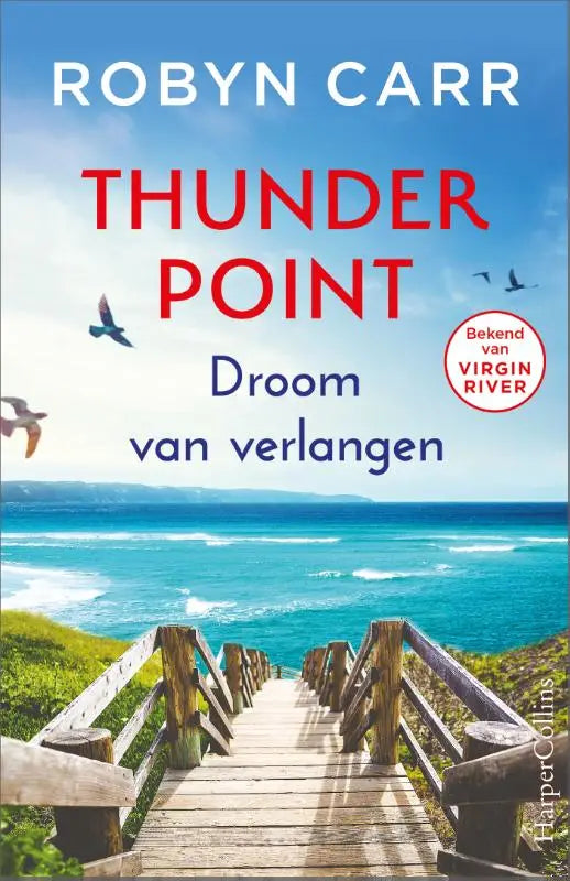 Boekomslag van thunder point door robyn carr met houten boardwalk naar oceaan onder blauwe lucht met vogels vliegend