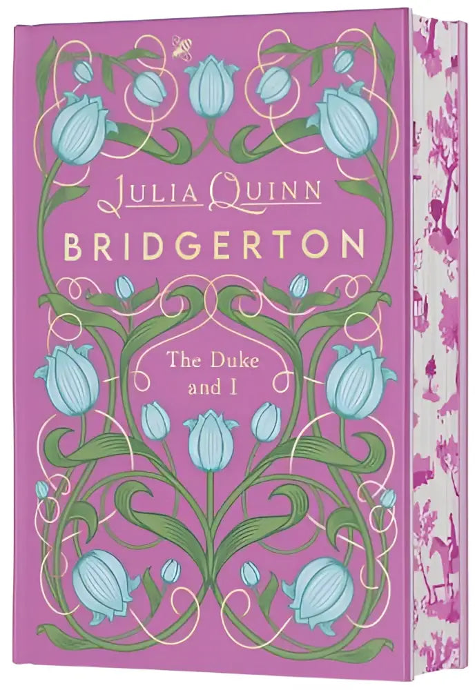 Een roze hardcover boek met een decoratieve omslag met lichte blauwe tulpen en groene wijnstokken, getiteld the duke and i deluxe collector’s edition door julia quinn