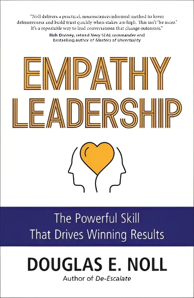 De boekcover van empathy leadership toont gouden letters en twee menselijke profielen die handen vasthouden, een skill that drives succes