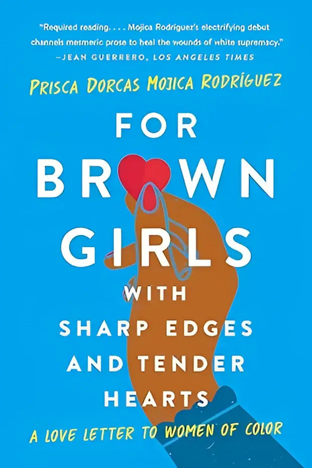 A vibrant blue book cover of For brown girls with sharp edges and tender hearts featuring an orange hand holding a red heart