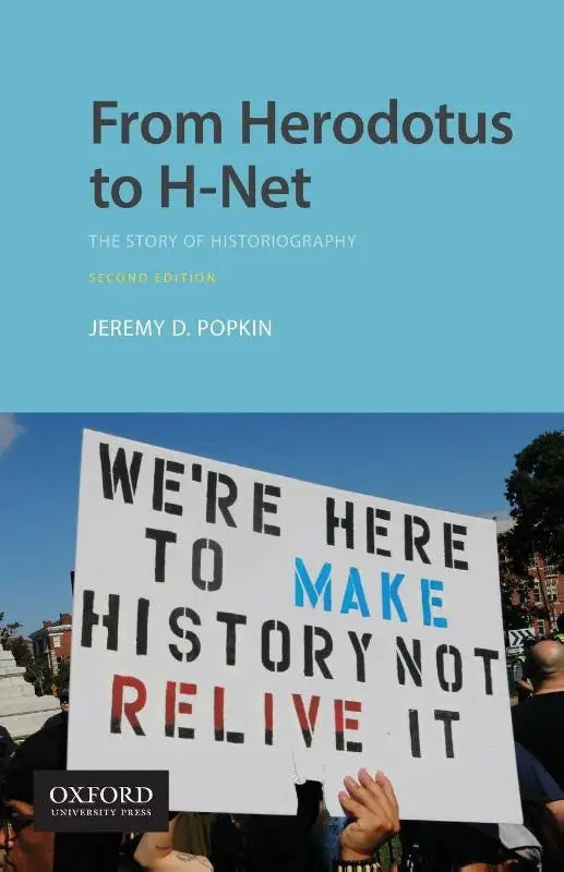 Wit protestbord met zwarte en blauwe letters we zijn hier om geschiedenis te maken in het boek from herodotus to h-net