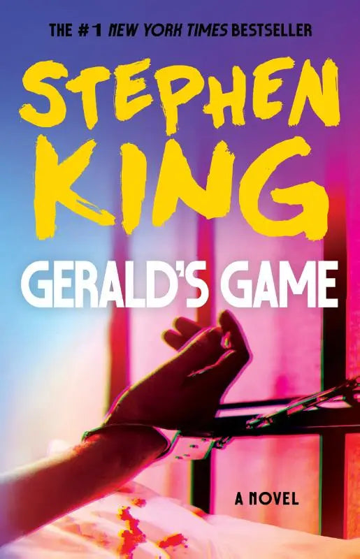 De cover van het boek Geralds game door Stephen King toont heldere gele en witte tekst op een levendige achtergrond
