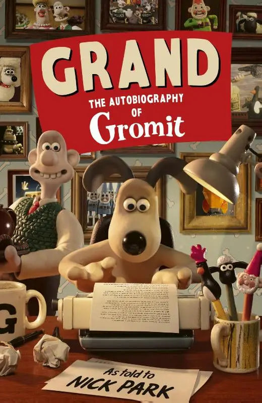 De cover van grand the autobiography of gromit toont de animatiefiguur gromit aan een bureau met typemachine van nick gromit park