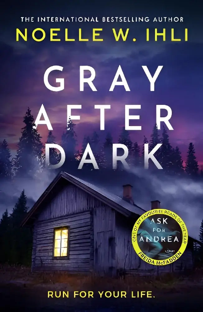 De boekcover van gray after dark toont een rustieke houten hut met een verlicht raam in een schemerachtige bosachtergrond