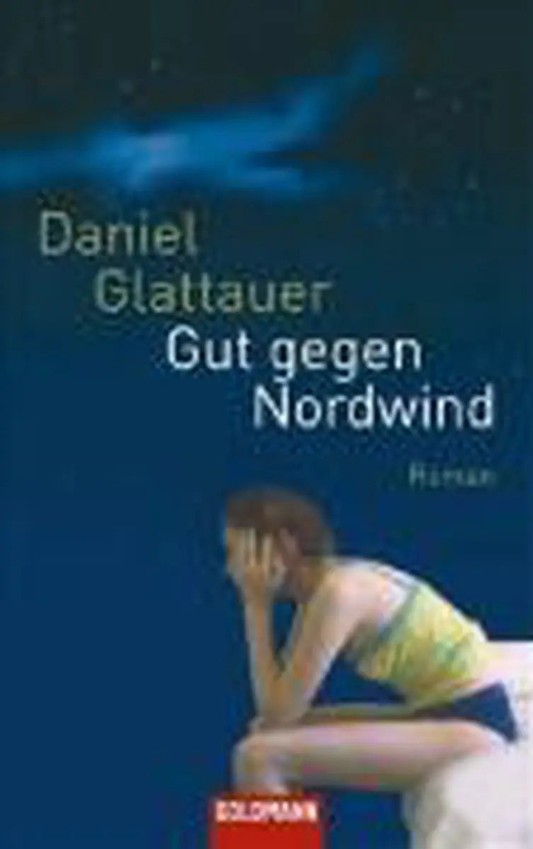 Blauwe boekomslag gut gegen nordwind met vrouw in geel shirt en blauwe short zittend op wit textiel door daniel glattauer