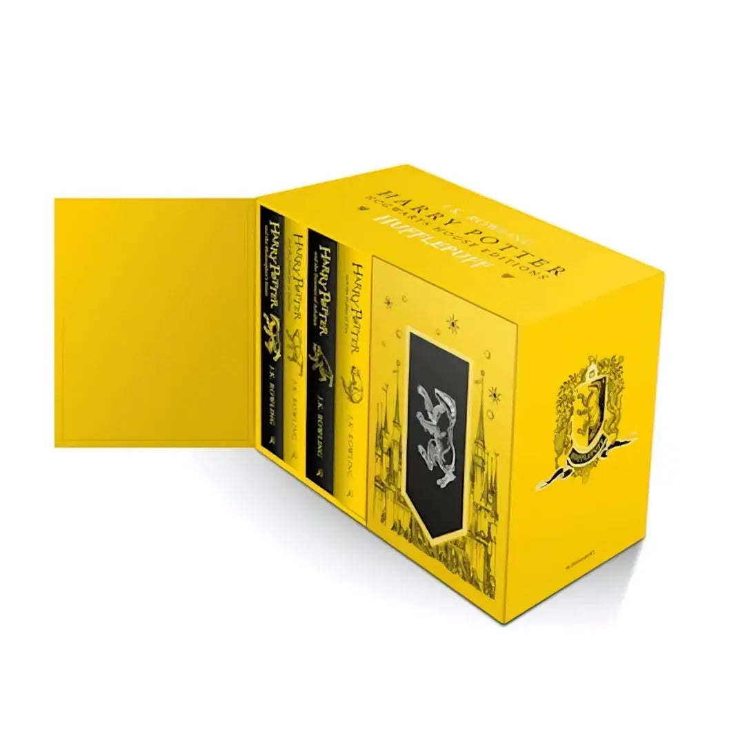 Bright yellow hardcover harry potter hufflepuff hogwarts house editions box set with black gold detailing and gryffindor crest