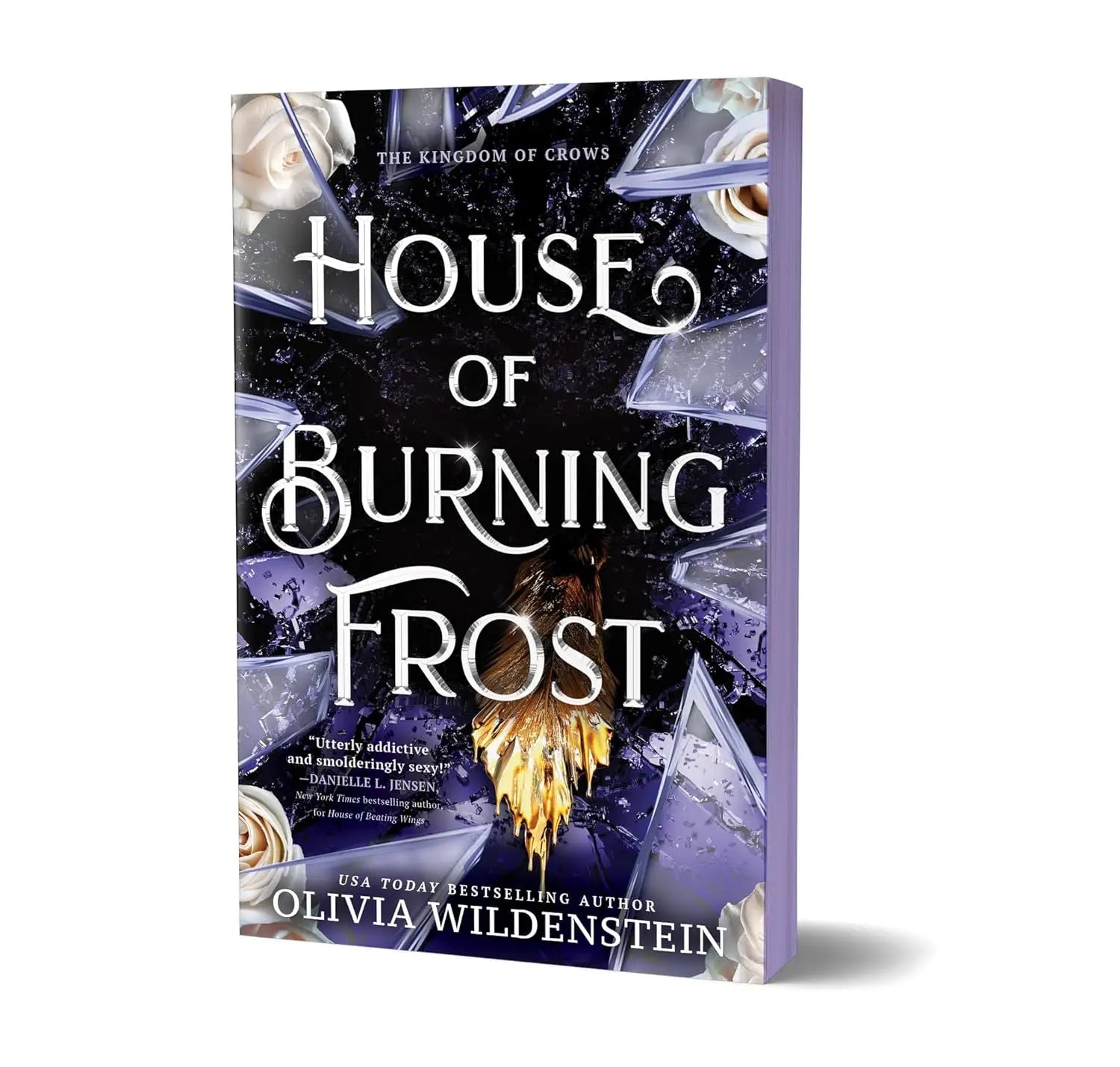 The book house of burning frost by olivia wildenstein features a dark shattered glass cover with white roses and gold accents