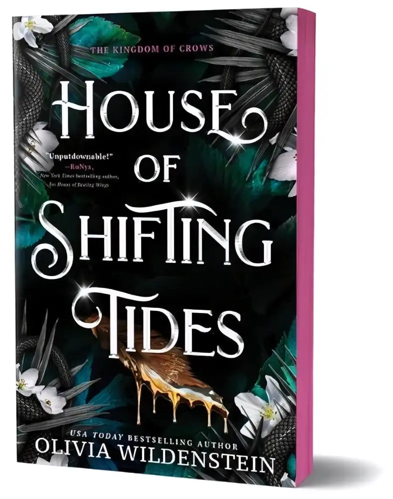 The house of shifting tides deluxe edition by olivia wildenstein features a dark teal cover with glowing white lettering and intricate crow illustrations