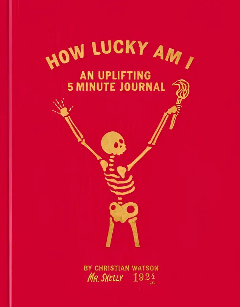Rood hardcover journal how lucky am i met gouden folietekst en skeletillustratie voor persoonlijke ontwikkeling door christian watson