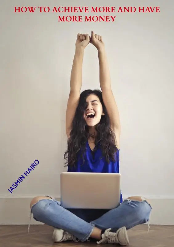 A woman in a blue top and ripped jeans laughs using a laptop in how to achieve more and have more money guide